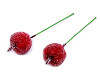 Artificial frosted apples on a wire