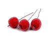 Artificial frosted apples on a wire