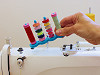 Soporte magnético para canillas de coser