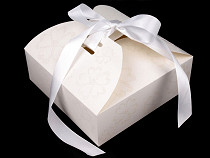 Boîte en carton avec ruban et paillettes 