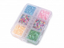 Conjunto de estrellas de lentejuelas en miniatura en caja de plástico
