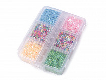 A set of mini star sequins in a plastic box