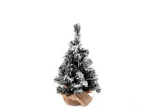 Artificial Christmas tree covered in snow