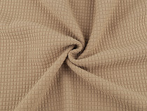 Knit fabric with a waffle pattern