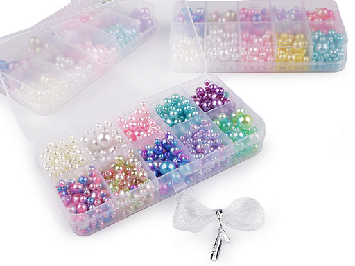 Set of plastic wax beads in a box