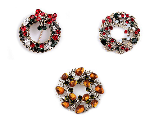 Broche de pedrería, corona, trineo