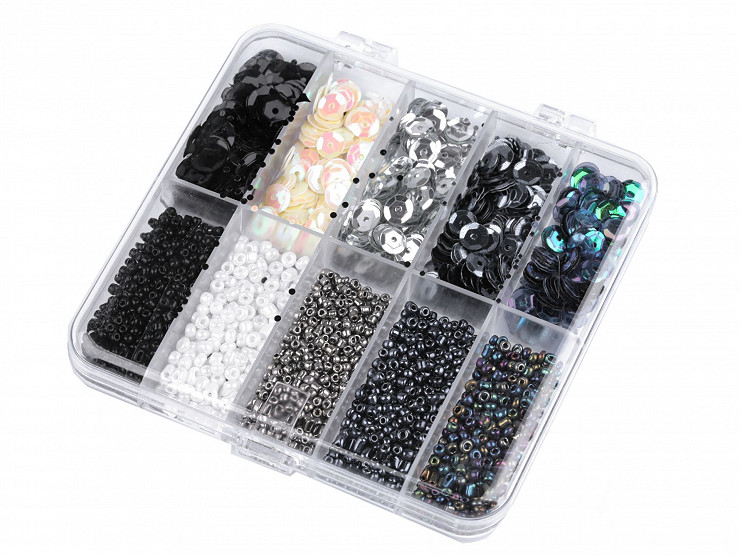 Conjunto de semillas y lentejuelas en caja de plástico