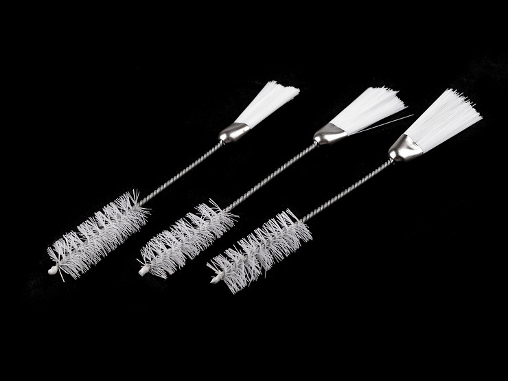 Double-sided brush for cleaning sewing machines